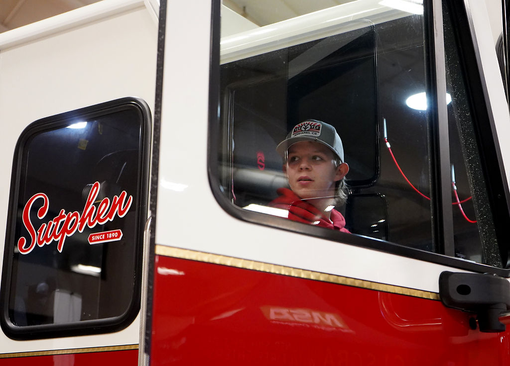Trenton Myers gets into the new firetruck